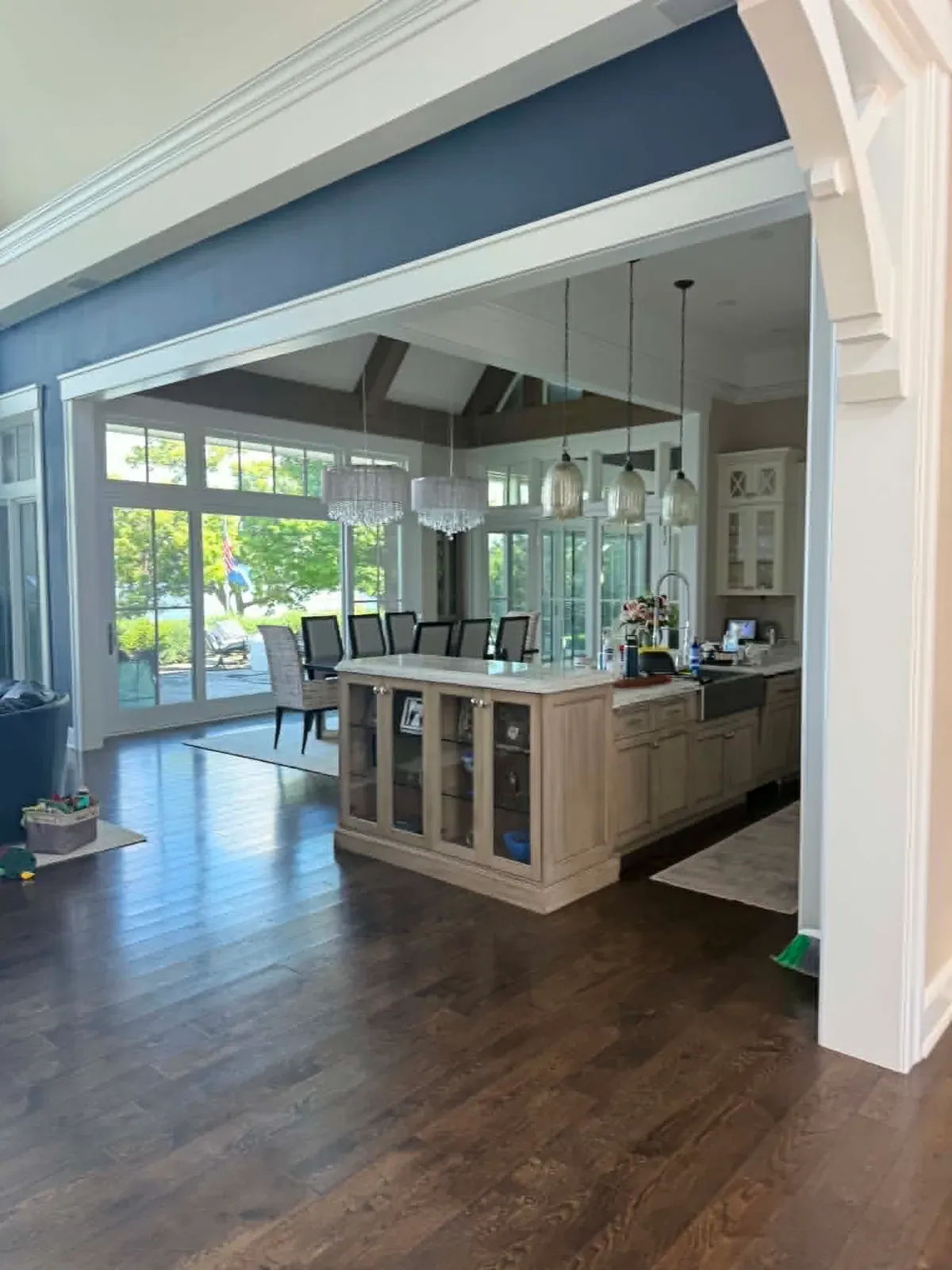 Open kitchen and dining area with newly refinished dark hardwood flooring
